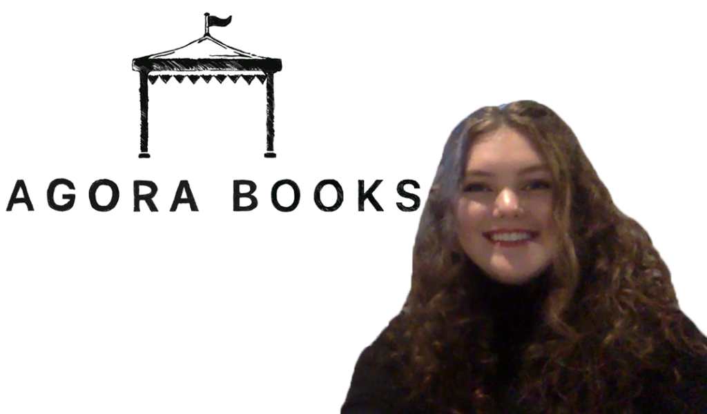 Girl smiling at camera in front of an Agora Books logo Zoom background. 